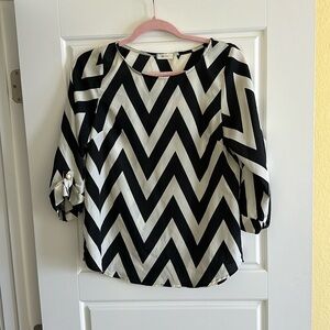 Black and ivory Chevron patterned blouse.